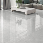 Pietra Lagos pearl polished porcelain tiles used across the walls and floor of a light contemporary interior