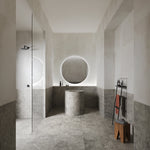 Portland One Grigio grey concrete-effect porcelain tiles laid across a contemporary interior floor