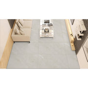 Jupiter Rock Ice matt porcelain tiles laid across a bright contemporary bathroom floor