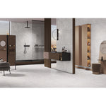 Nexus Natural polished porcelain tiles used across the walls and floor of a bright open interior