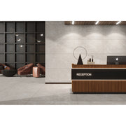 Nexus Taupe polished porcelain tiles laid across the floor and walls of a warm neutral living space