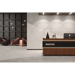 Nexus Taupe polished porcelain tiles laid across the floor and walls of a warm neutral living space
