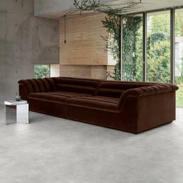 Pietra Lagos pearl matt porcelain tiles laid across the floor and walls of a bright modern living space