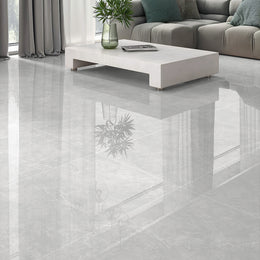 Pietra Lagos pearl polished porcelain tiles used across the walls and floor of a light contemporary interior