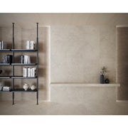 Portland One Bianco concrete-effect porcelain tiles laid across a bright open-plan interior floor