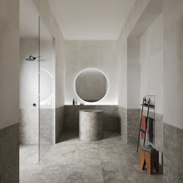 Portland One Grigio grey concrete-effect porcelain tiles laid across a contemporary interior floor